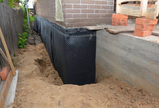 Happy homeowners after waterproofing job in Pleasantville